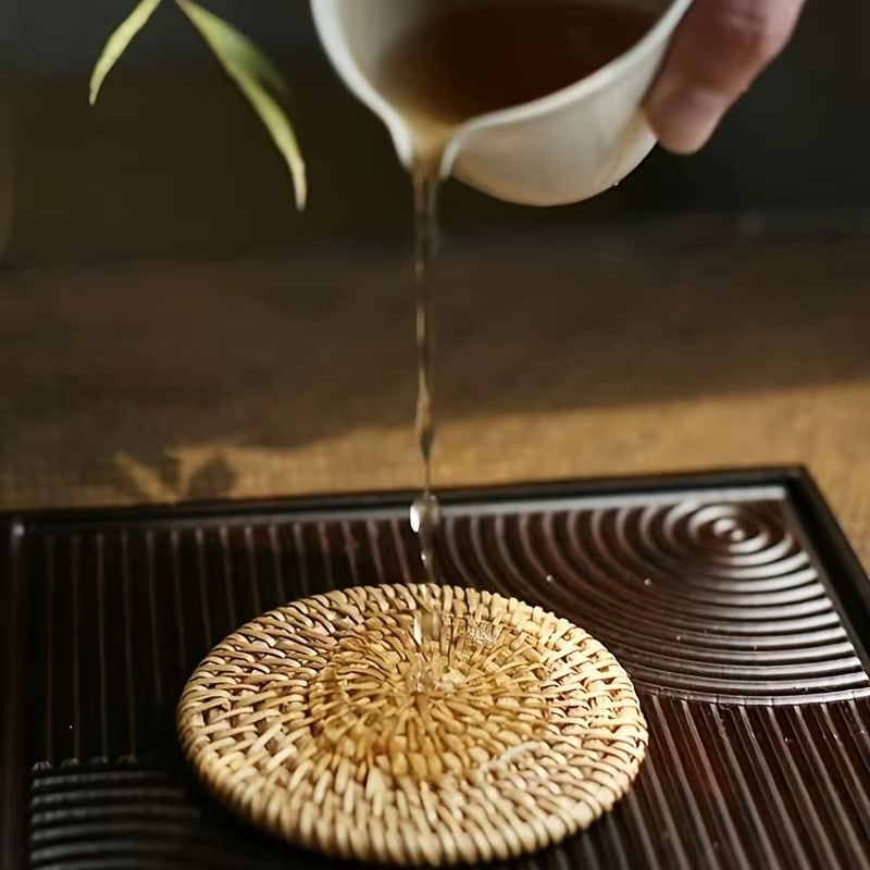 Round tightly woven rattan coaster in a warm honey brown