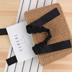 Structured summer handbag hand woven in natural straw with a honeycomb texture