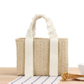 Structured summer handbag hand woven in natural straw with a honeycomb texture