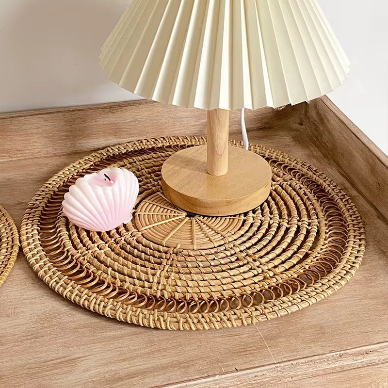Round woven bamboo placemat with rays radiating from the center like a sun