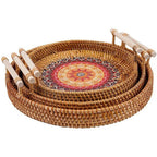 Round rattan tray with radiating sun weave and wooden handles