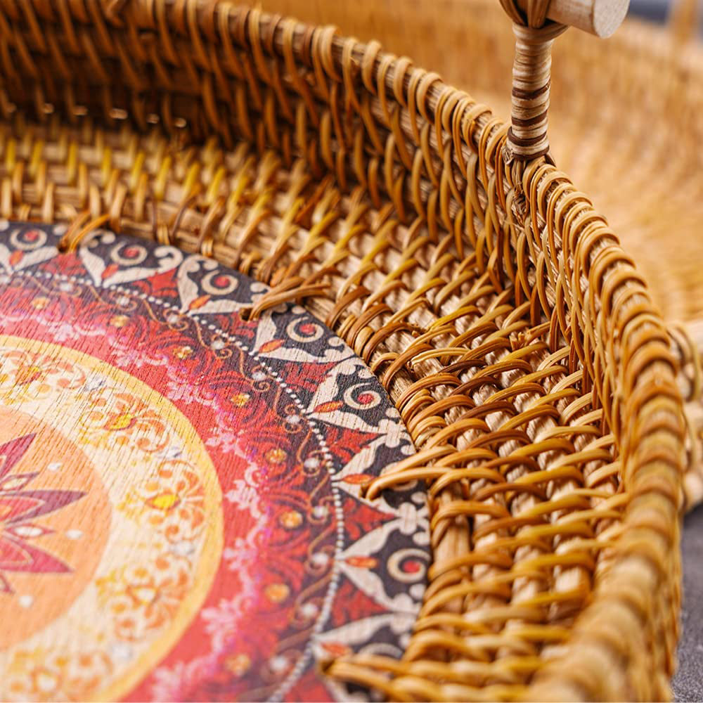 Round rattan tray with radiating sun weave and wooden handles