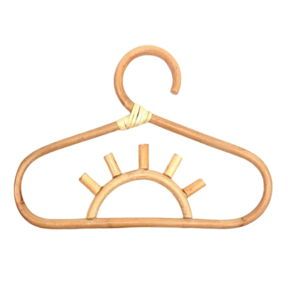 Kids' clothes hanger hand woven in natural rattan in a sun shape