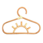 Kids' clothes hanger hand woven in natural rattan in a sun shape