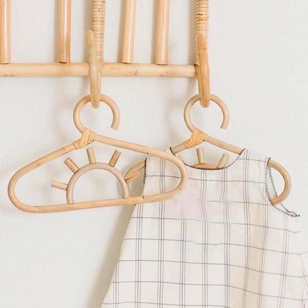 Kids' clothes hanger hand woven in natural rattan in a sun shape