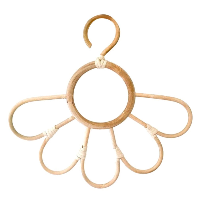 Kids' clothes hanger hand woven in natural rattan in a sunflower shape