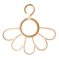 Kids' clothes hanger hand woven in natural rattan in a sunflower shape