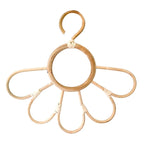 Kids' clothes hanger hand woven in natural rattan in a sunflower shape