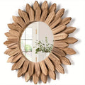 Round mirror surrounded by carved wooden sunflower petals