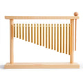 Tabletop bar chime with golden metal tubes on a bamboo wood stand