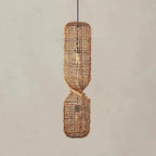Tall pendant light made of two stacked woven rattan cylinders