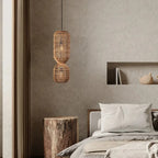 Tall pendant light made of two stacked woven rattan cylinders