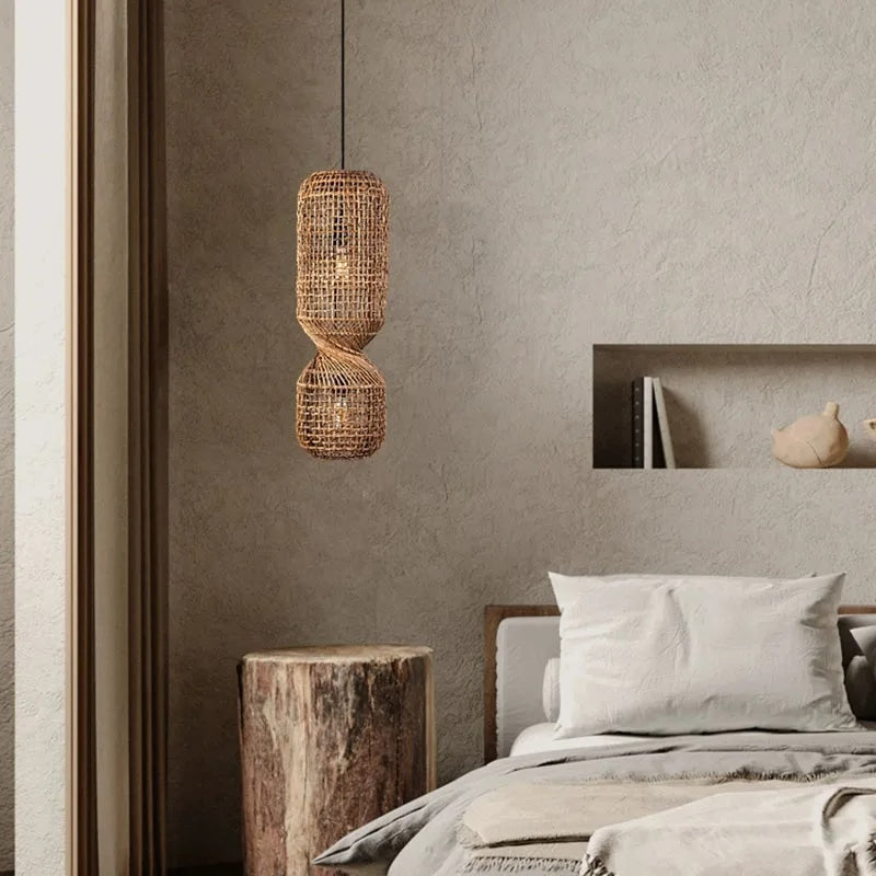 Tall pendant light made of two stacked woven rattan cylinders