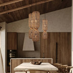 Tall pendant light made of two stacked woven rattan cylinders