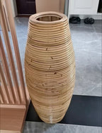 Group of tall natural bamboo floor vases in three heights