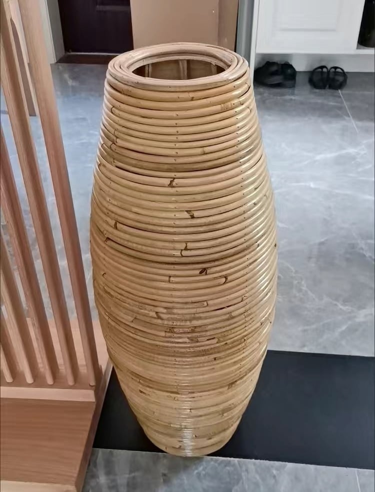 Group of tall natural bamboo floor vases in three heights