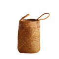 Tall woven brown basket with rattan handles