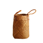 Tall woven brown basket with rattan handles