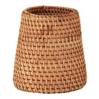 Small tapered woven rattan basket holding dried flowers