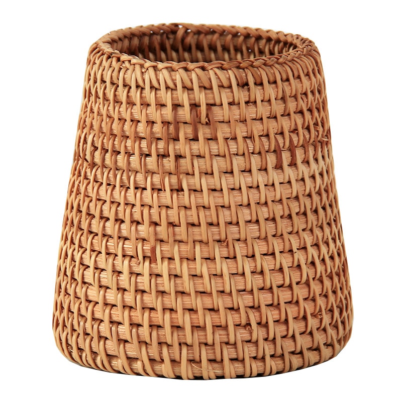 Small tapered woven rattan basket holding dried flowers