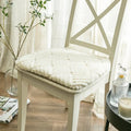 Round thick plush chair cushion with a woven look pattern like rattan