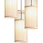 Three woven bamboo cylinder shades hanging from a round black canopy