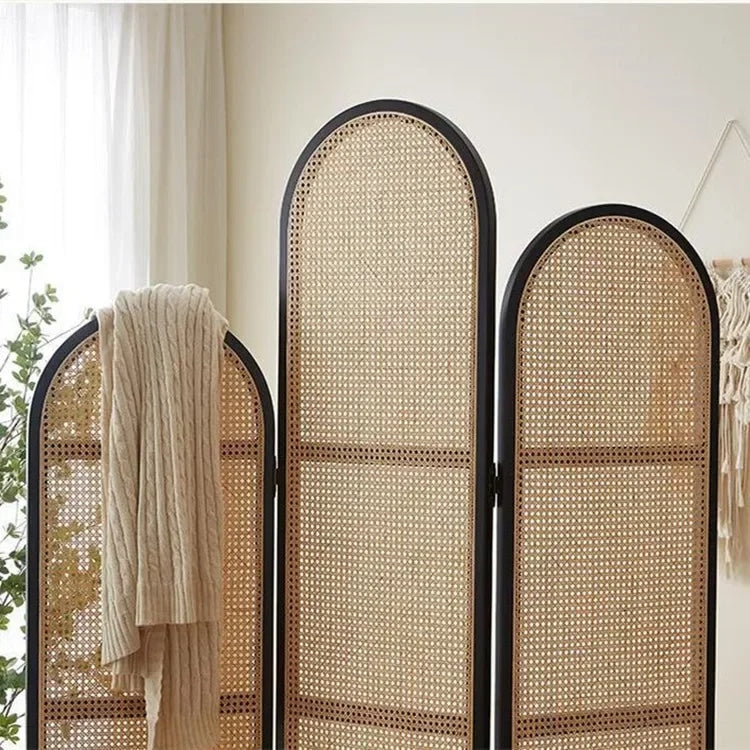 Three panel room divider with a dense hand woven rattan weave on a wood frame