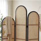 Three panel room divider with a dense hand woven rattan weave on a wood frame