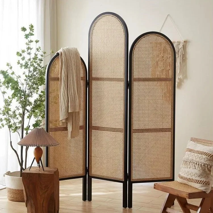 Three panel room divider with a dense hand woven rattan weave on a wood frame