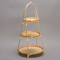 Three tier fruit basket stand with woven trays on a bamboo frame