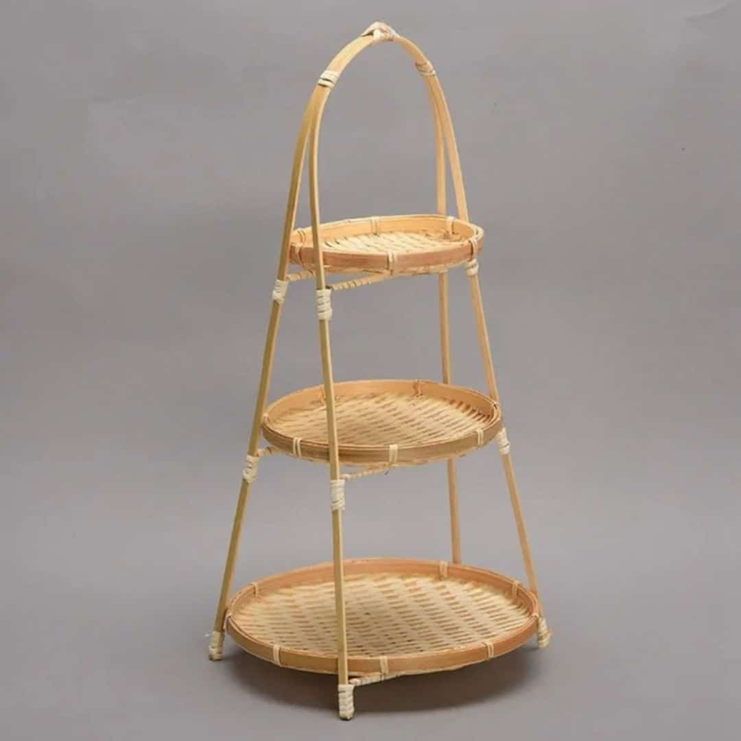 Three tier fruit basket stand with woven trays on a bamboo frame