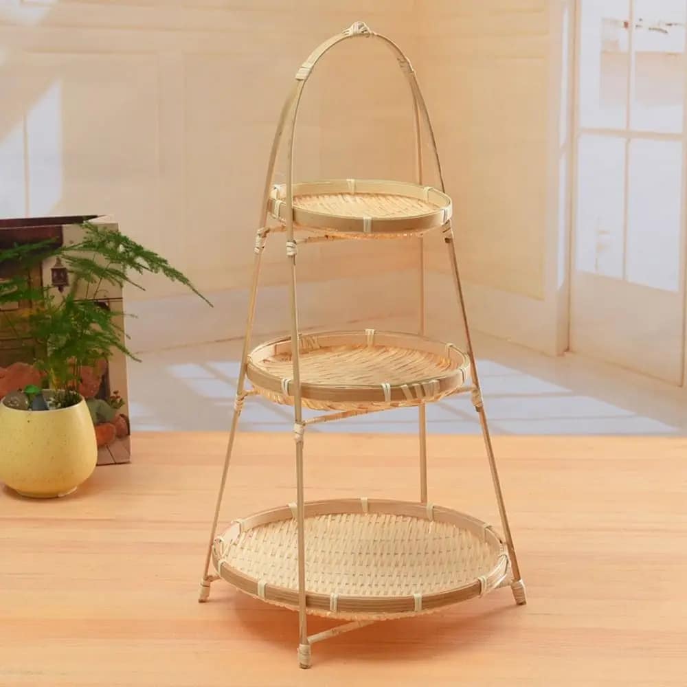 Three tier fruit basket stand with woven trays on a bamboo frame