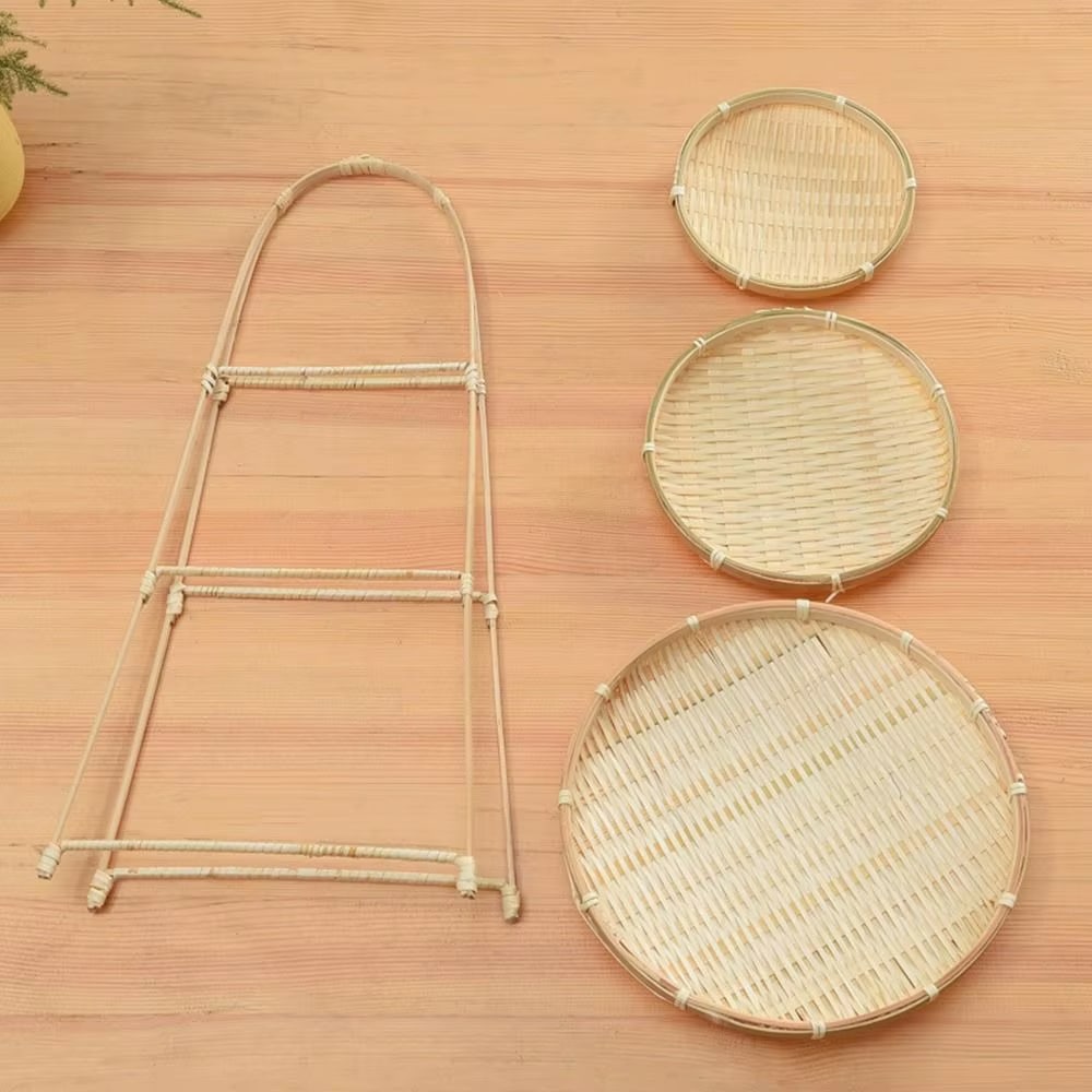Three tier fruit basket stand with woven trays on a bamboo frame