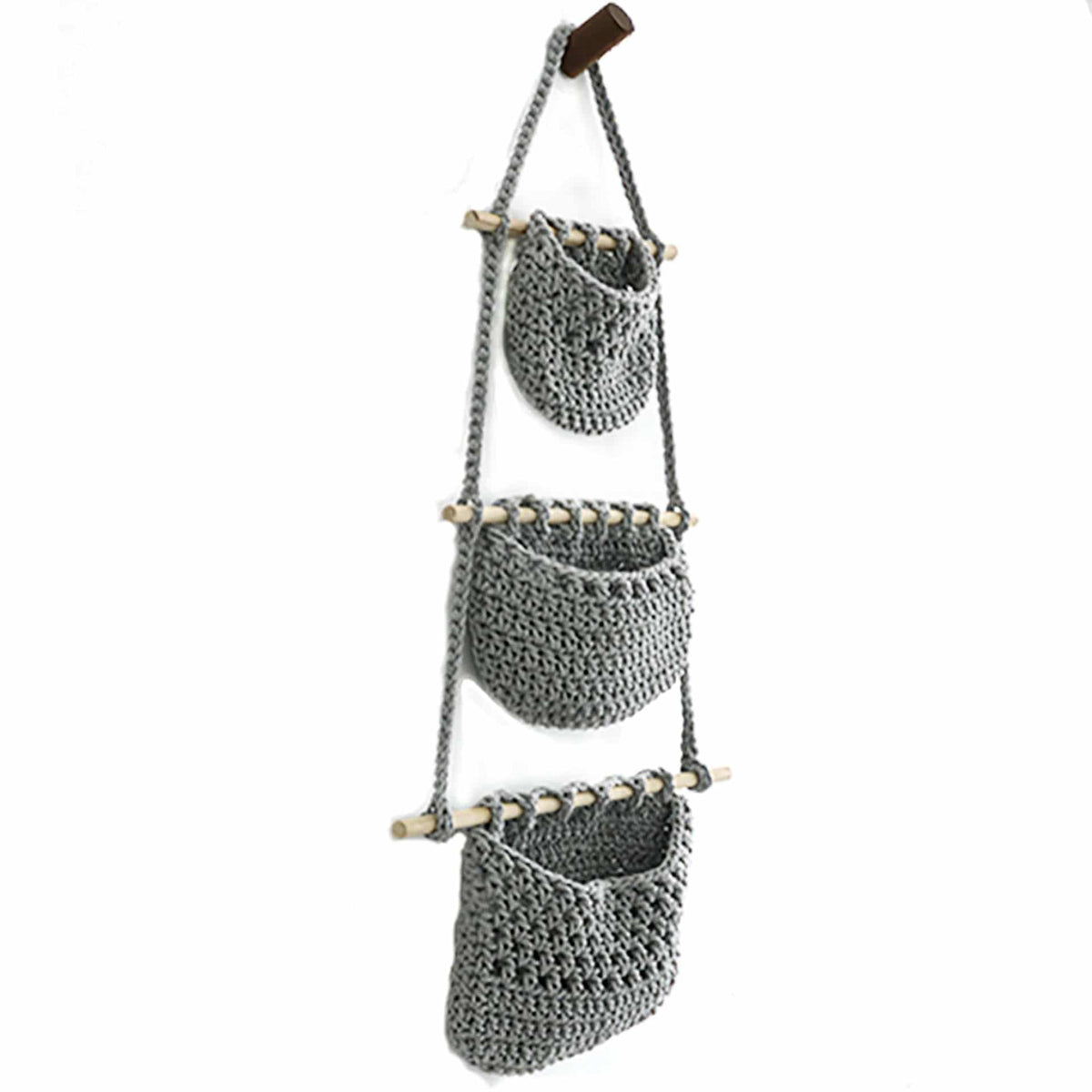 Three stacked pink hanging wall baskets on a rope