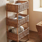 Three tier shelf with three woven rattan baskets on a wood frame