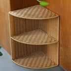 Three tier quarter circle corner shelf with a brown woven rattan look