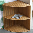 Three tier quarter circle corner shelf with a brown woven rattan look