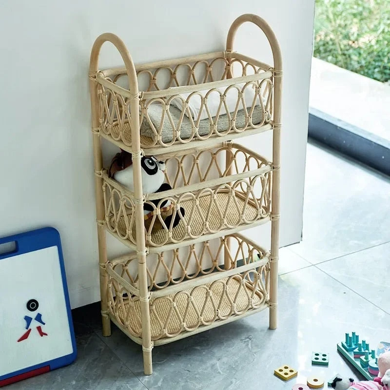 Three tier shelf with hand woven beige rattan shelves on a wood frame
