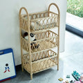 Three tier shelf with hand woven beige rattan shelves on a wood frame