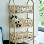 Three tier shelf with hand woven beige rattan shelves on a wood frame