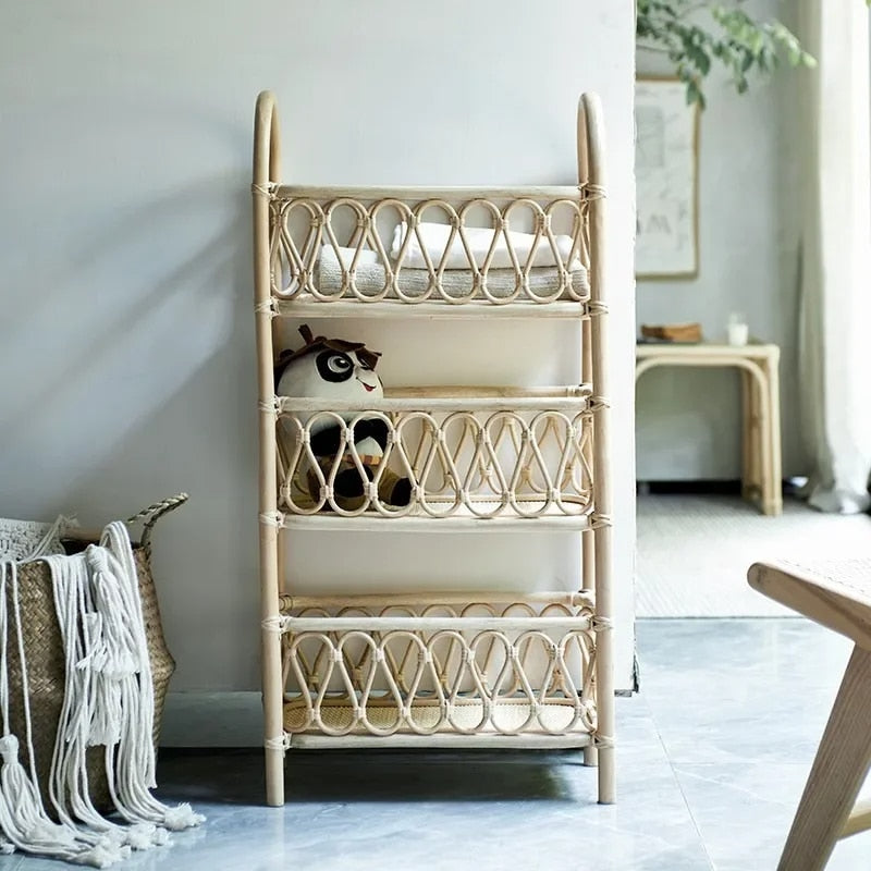 Three tier shelf with hand woven beige rattan shelves on a wood frame
