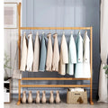 Freestanding wood coat stand shaped like a tree with branching hooks