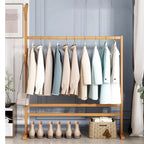 Freestanding wood coat stand shaped like a tree with branching hooks