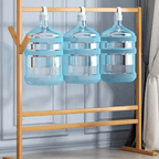 Freestanding wood coat stand shaped like a tree with branching hooks