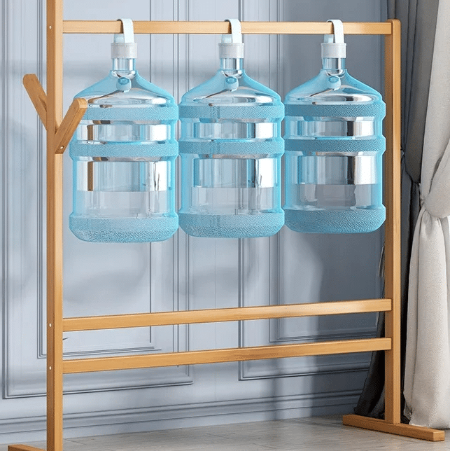 Freestanding wood coat stand shaped like a tree with branching hooks