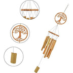 Bamboo wind chime with a carved tree of life medallion above the tubes