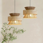 Two tier pendant light with cane webbing drum and woven rattan top