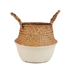 Two tone woven belly basket with green base holding white flowers