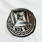 Hand woven rattan planter with black and natural two tone weave