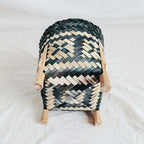 Hand woven rattan planter with black and natural two tone weave